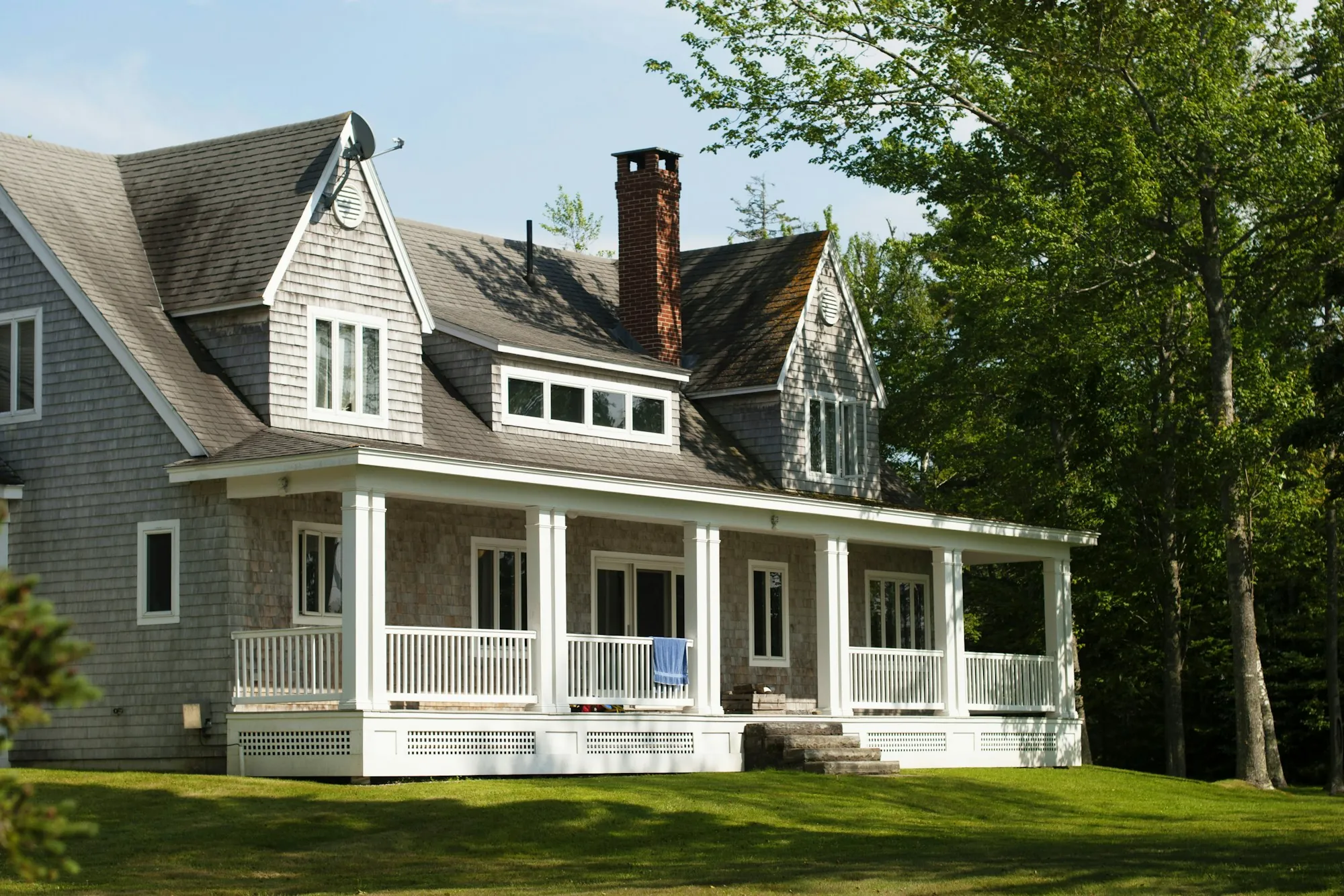 White house with a wraparound porch