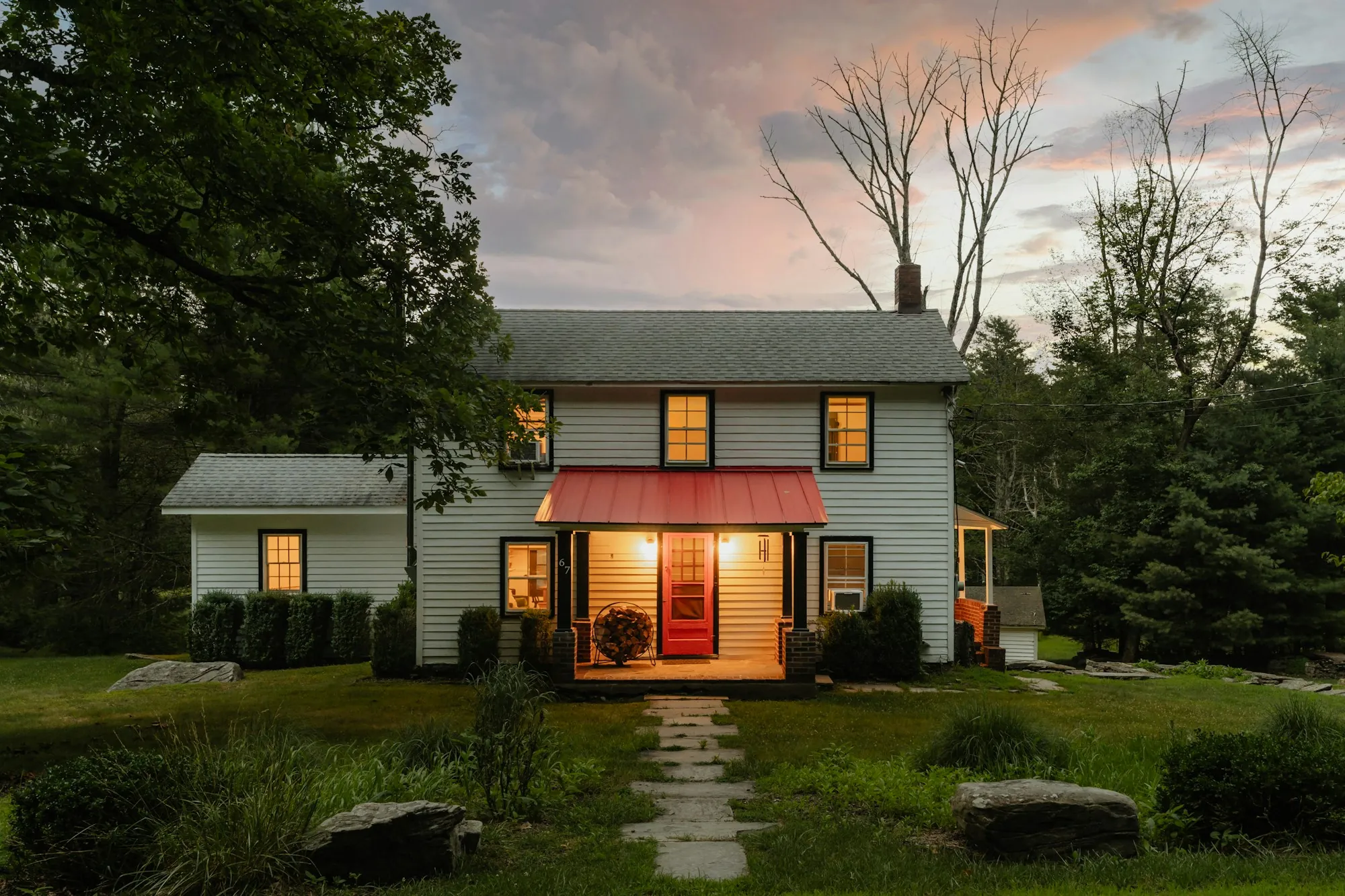 House with warm lights on at dusk